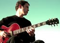 Brian Prunka playing guitar